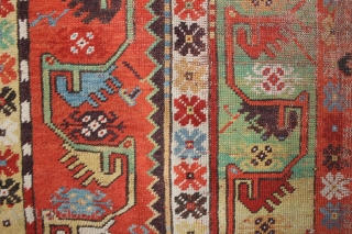 Antique Melas rug, 155x99 cm. good colours and a very nice old looking border. A lot of wear in the center, a dark spot and a 20 cm. long slit at the  ...