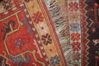 Antique Melas rug, 155x99 cm. good colours and a very nice old looking border. A lot of wear in the center, a dark spot and a 20 cm. long slit at the  ...