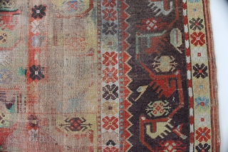 Antique Melas rug, 155x99 cm. good colours and a very nice old looking border. A lot of wear in the center, a dark spot and a 20 cm. long slit at the  ...