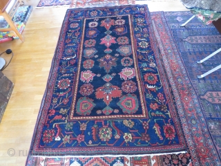 Perhaps a Feridan rug, in dozar size, made about 1930. OK condition with just some wear and nice colours.              