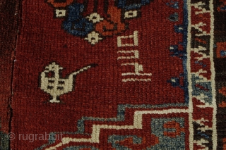 Old dated Konya area rug, 1250/1834 or 1256/1840, woven in two halfes, 167x150, holes,a few old restauration and corrosion in some of the brown areas.
Metal tread high lights in the dated half. 