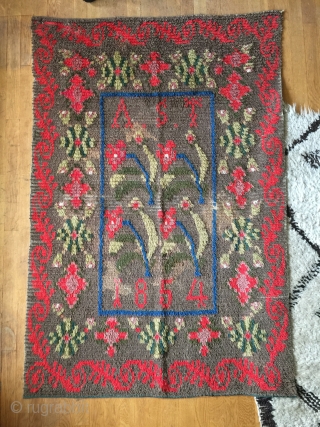 Small ryijy rug, probably from Åland, Finland, signed and dated AST 1854. It measures 134x93 cm. and has a few bright spots.           