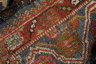 Probably antique and made somewere in NW Persia I guess, Kurdish I think and a lot of different colours, that´s for sure, some fading in the yellow, 310x140-154 cm.
Nice even wear, but  ...