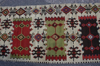 Nice Central Anatolian fragment, 441x65 cm. with good colours and holes and corrosion. Probably first half 19th century. Related to a kelim published in: Gewebte Poesi, Samlung Kozett, plate 41. Not washed  ...