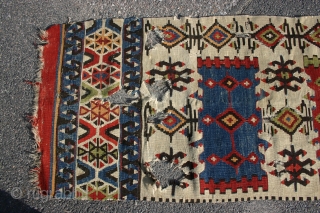 Nice Central Anatolian fragment, 441x65 cm. with good colours and holes and corrosion. Probably first half 19th century. Related to a kelim published in: Gewebte Poesi, Samlung Kozett, plate 41. Not washed  ...
