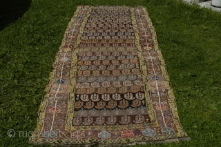 Very strange and exiting NW Persian rug, perhaps mid 19th c. with the most beautiful border and very good colours. Reduced at one end, 315x106 cm.
Some irregular knoting, mostly good pile and  ...