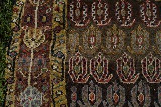 Very strange and exiting NW Persian rug, perhaps mid 19th c. with the most beautiful border and very good colours. Reduced at one end, 315x106 cm.
Some irregular knoting, mostly good pile and  ...