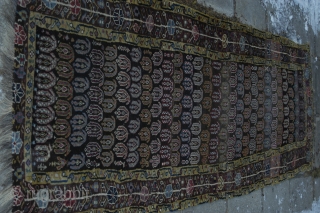 Very strange and exiting NW Persian rug, very good colours and a lot of them. Reduced at one end, 315x106 cm.
Some irregular knoting, mostly good pile and four restored areas, the biggest  ...