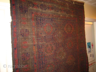 Very old Baluch main carpet, hard wear, some holes fixed with parts from old kelims, pile rugs and weft float textiles.
The red colour is very good, a lot of different blue hues  ...