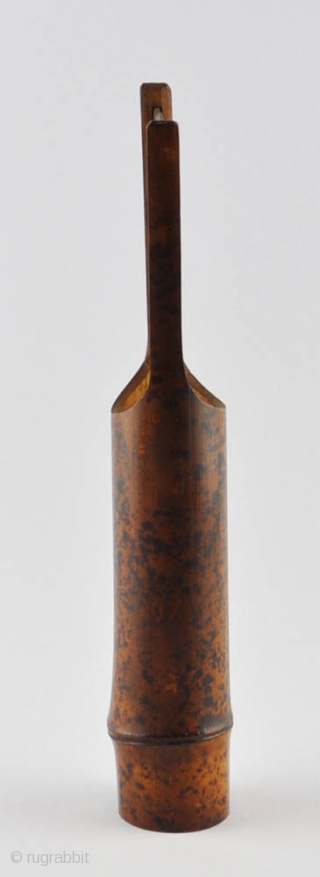 An elegant simple Japanese flower vase (hanaire) of dark bamboo with a natural design of black spots and an attractive patina. Unsigned.Probably first half of 20th century. 32x5 cm.    