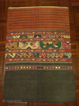 A lovely 'Tai Lue' tube skirt from Laos, possibly from Bo Keaw or Udomxay. All hand spun cotton. A two seams skirt with center banners of discontinuous supplementary weft work in animal  ...