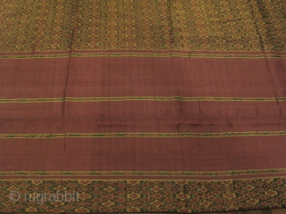 A weft ikat silk tube skirt from Northeastern part of Thailand with an incredible field of fine diamond lattice motif. Strong evident of Cambidian influence on pattern and form. Est age 40-60  ...