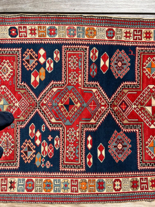 Antique Caucasian Armenian Kazak– ca. 1900
Size: 115 × 182 cm

Bold Armenian Kazak rug featuring large cruciform medallions on a deep blue field, stepped geometric forms, and strong architectural borders. Classic village weaving  ...