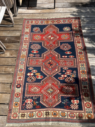Antique Caucasian Armenian Kazak– ca. 1900
Size: 115 × 182 cm

Bold Armenian Kazak rug featuring large cruciform medallions on a deep blue field, stepped geometric forms, and strong architectural borders. Classic village weaving  ...