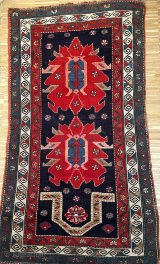 Caucasian Kazak Rug with Turtle Medallions, ca. 1885–1910
90 × 160 cm | Wool on wool | Symmetrical knots | Red wefts

A bold and compact village weaving with twin stylized “turtle” medallions on  ...