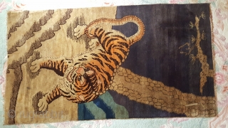 Early 20th century Baotou tiger rug. They are generally associated with tantric rituals whilst Chinese tiger rugs celebrate the fierceness and courage of the tiger as the protector against demons and evil  ...