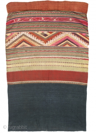 Name: Woman’s skirt/Ceremonial textile
Local Name: Sin mii kan
Ethnic Group: Tai Lue
Origin: Northwest Laos
Materials: Cotton, silk, natural and synthetic dyes
Techniques: Discontinuous supplementary weft, weft ikat
Age: Early 20th century
Size: 100 x 60 cm

Tubular skirts  ...