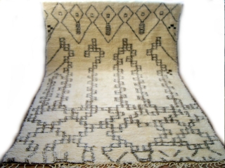 MOROCCAN MIDDLE ATLAS BERBER CARPET. An attractive example from Beni Ourain with varied abstract designs. The pile is lustrous and the condition is perfect. Reference 2296. Size 297 x 188cms. 9ft.9in. x  ...