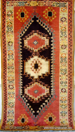 MOROCCAN HIGH ATLAS BERBER RUG which originates from Ouzguite in the High Atlas. The centre panel is of undyed black and brown wools and the piece dates from the early 20th century.  ...