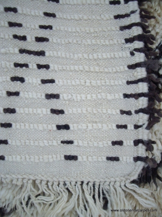 MOROCCAN BERBER BENI OURAIN RUG in which the warps, wefts and sumptuous long, silky knotted pile are all of hand spun undyed Berber wools. The simple lattice design is very pleasing. The  ...