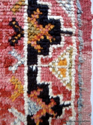 MOROCCAN BERBER RUG originating from the High Atlas mountains and the Ait Ouaouzguite Berbers. This region lies south of Marrakesh. At each end of the field there is a design which translates  ...