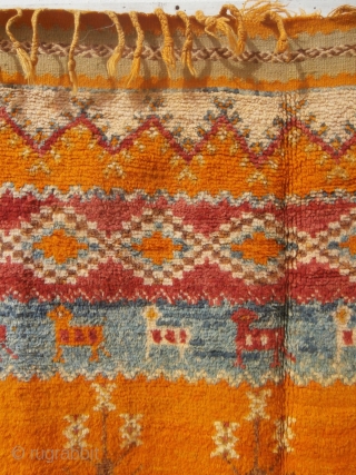 MOROCCAN HIGH ATLAS BERBER CARPET, an old and rare piece in excellent condition which is from the Ait Tamassine Berber group. The weaver has included in her random designs depictions of traditional  ...