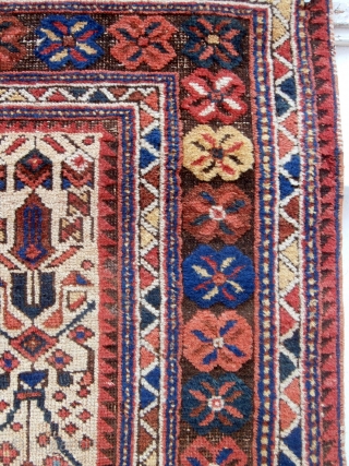 ANTIQUE AFSHAR RUG dating from the early 1900s. The rug has glowing natural colours especially in the flower heads which make up the main borders. There is corrosion in keeping with age  ...