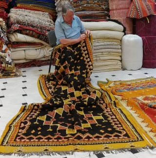 MOROCCAN BERBER HIGH ATLAS CARPET from the Ait Zenaga Berber tribe. Although the deep field color is typical of Ait Zenaga weaving the rest of the colors and design are most unusual  ...