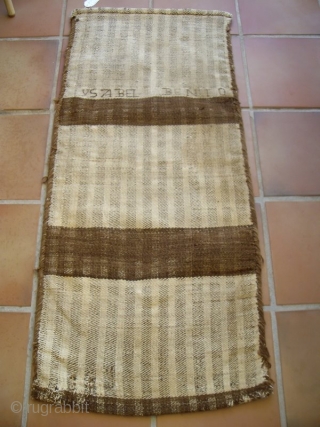 RARE SPANISH GRAIN BAGS, a collection of 5 examples of early 20th C. rural spanish weavings. These bags are woven from undyed, lustrous wool. Three are inscribed with names which are spelled  ...