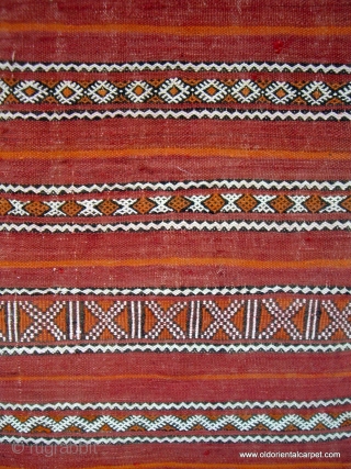 MOROCCAN BERBER MIDDLE ATLAS FLAT WEAVE / KILIM. The shape and fineness of weave and embroidery indicate that this would have been used as a cape for a Berber woman, probably for  ...