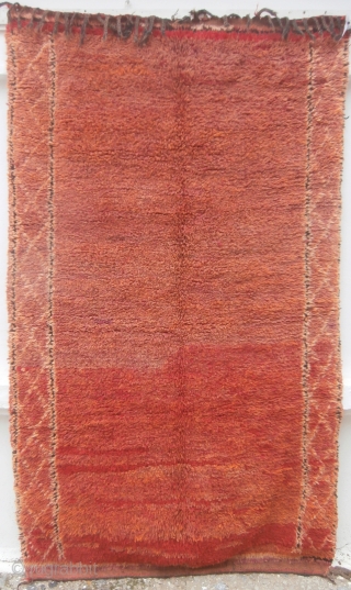 MOROCCAN BERBER MIDDLE ATLAS RUG which is old, supple and soft and has a knotted pile of many shades of madder ranging from tan through to reds and hints of purple. It  ...