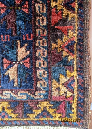 BALUCH/BELOUCH RUG from the region of Herat in western Afghanistan, circa 1950. Although small and in the format of a grain bag face there is no evidence that it was used for  ...