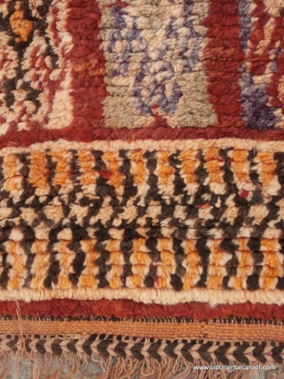 MORROCAN BERBER MIDDLE ATLAS CARPET. A large carpet from the region of Boujad which, unusually for this origin, has a well balanced overall design in which chestnut shades predominate. Other colours are  ...