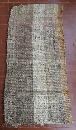 Old Tibetan Wangden rug, khaden size (circa 166 by 75 cm), born without fringes, unusual secular type with rare checkerboard pattern, natural undyed brown and white wool, “big knot” rough village weaving,  ...