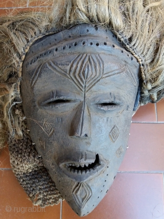 Stunning and rare Chokwe ritual full suit with wooden mask for a medicine-man, complete with two brass bangles and a circumcision knife; Angola, Central Africa, mid-20th century or maybe earlier. This interesting  ...