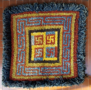 Old Tibetan Wangden rug, large khagangma square size (circa 90 by 90 cm) for monastic use, powerful five swastikas design, genuine and excellent condition, no repairs. More photos on request.   