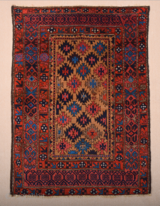 Late 19th Century North East Persian Belüch Rug. This small Baluch woven in the symmetrical knot is from the Qainat region and maybe a weaving of the Bahluli tribe. The camel field  ...