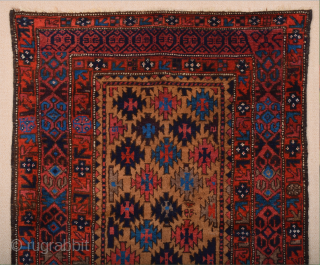 Late 19th Century North East Persian Belüch Rug. This small Baluch woven in the symmetrical knot is from the Qainat region and maybe a weaving of the Bahluli tribe. The camel field  ...