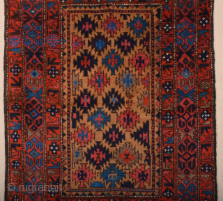 Late 19th Century North East Persian Belüch Rug. This small Baluch woven in the symmetrical knot is from the Qainat region and maybe a weaving of the Bahluli tribe. The camel field  ...