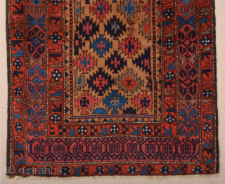 Late 19th Century North East Persian Belüch Rug. This small Baluch woven in the symmetrical knot is from the Qainat region and maybe a weaving of the Bahluli tribe. The camel field  ...