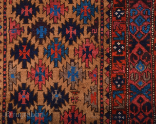 Late 19th Century North East Persian Belüch Rug. This small Baluch woven in the symmetrical knot is from the Qainat region and maybe a weaving of the Bahluli tribe. The camel field  ...