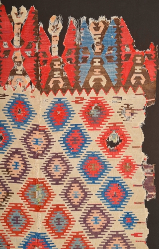 Early example!A fragment of a two-panel kilim from the surroundings of Central Anatolian Sivas, 18th Century Kilim Fragment. It has perfect colors and archaic ends. Size 135 x 230 cm It has  ...