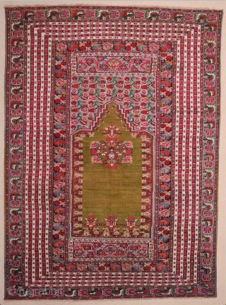 This 19th Century Anatolian Ghordes Green ground prayer rug displays an open field and a steeply towering mihrab shape
It's in perfect condition The prayer rugs of this group were a specialty of  ...