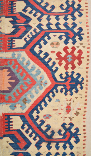 This impressive white-ground kilim is a weaving of the Hotamis Turkmen of the Konya region. It is woven in one piece, so unlike the two-panel kilims of this group there is no  ...