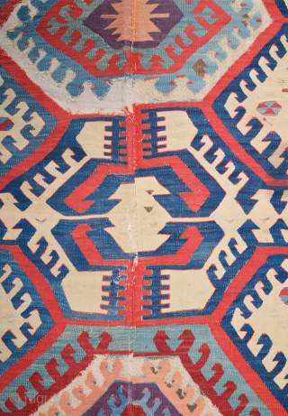 This impressive white-ground kilim is a weaving of the Hotamis Turkmen of the Konya region. It is woven in one piece, so unlike the two-panel kilims of this group there is no  ...