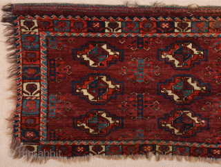 This brown-ground nine-gül Yomut Torba has strikingly large secondary motifs and the main border of small plants.Lovely Border.Early 19th Century Size 45 x 100 cm        