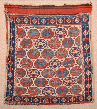 South East Caucasus, Moghan region Half of a Moghan Shahsavan Khorjin. The white-ground face woven in the Sumakh technique shows a repeat of offset rows of hexagons enclosing so-called spider güls. The  ...