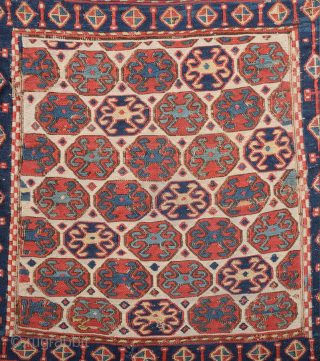 South East Caucasus, Moghan region Half of a Moghan Shahsavan Khorjin. The white-ground face woven in the Sumakh technique shows a repeat of offset rows of hexagons enclosing so-called spider güls. The  ...