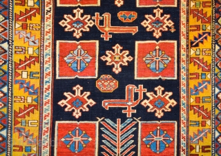 East Caucasian Karagashli Rug Ten red box shapes with a central rosette lie along the central axis of the blue field, interspersed with the abstract birds that are characteristic of the provenance;  ...