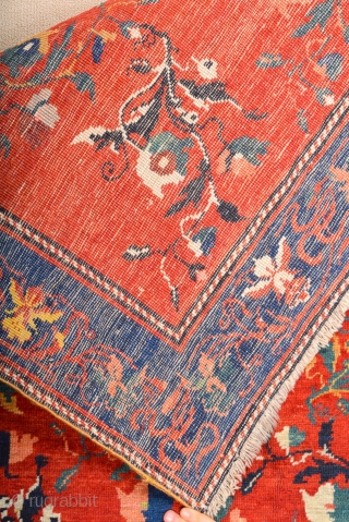 South Caucasian Karabagh Rug. In the Red field, short stems arranged in parallel rows combine into a dense repeat in shades of green, red and pink. Each stem bears a large blossom.  ...
